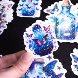 Butterfly Potions Handmade Holographic Vinyl Sticker Set of 8, perfect magical witchy bullet journal gift. In this set, you'll discover 8 potions, each infused with delicate butterfly elements, casting a spell of whimsy and magic.