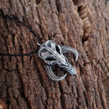 Mythosaur skull necklace in resin and aluminum powder from The Mandalorian