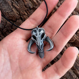 Mythosaur skull necklace in resin and aluminum powder from The Mandalorian