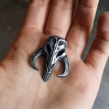 Mythosaur skull necklace in resin and aluminum powder from The Mandalorian
