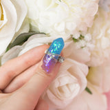 Rinie ring with adjustable metallic base and purple resin crystal