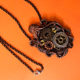 Abyss Machine bronze, silver and gold resin Steampunk necklace