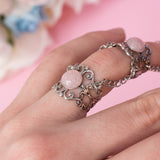 Angel Claw ring with adjustable metallic base and pink stones 1