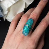 Guardian Angel ring with adjustable metallic base and resin crystal