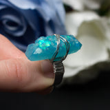 Guardian Angel ring with adjustable metallic base and resin crystal