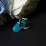 Guardian Angel ring with adjustable metallic base and resin crystal