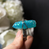 Guardian Angel ring with adjustable metallic base and resin crystal