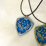 hylian shield necklace link legend of zelda, nintendo gamer pendant geek friendship gift. rupie resin charm, triforce metal jewelry. navi best friend jewel breath of the wild chain, ocarina girlfriend nerd female choker. women geekery birthday, male videogame christmas. unique lightweight present, weapon cosplay anniversary