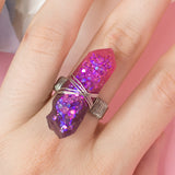 Losille ring with adjustable metallic base and resin crystal