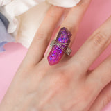 Losille ring with adjustable metallic base and resin crystal