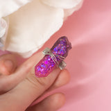 Losille ring with adjustable metallic base and resin crystal