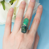 Malbeth ring with adjustable metallic base and resin crystal