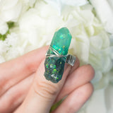 Malbeth ring with adjustable metallic base and resin crystal