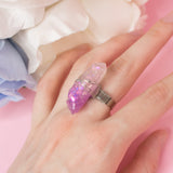 Narwain ring with adjustable metallic base and resin crystal