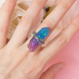 Rinie ring with adjustable metallic base and purple resin crystal 