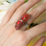 Taras ring with adjustable metallic base and resin crystal