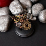 vintage ring with metal filigree base and gears lovecraft style